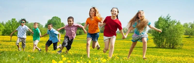 Children running in a field